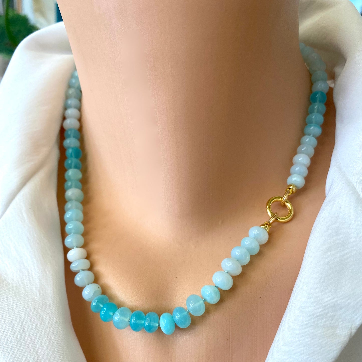 Opal candy necklace with sky blue opal beads and gold clasp, showcasing a fresh spring and summer style.