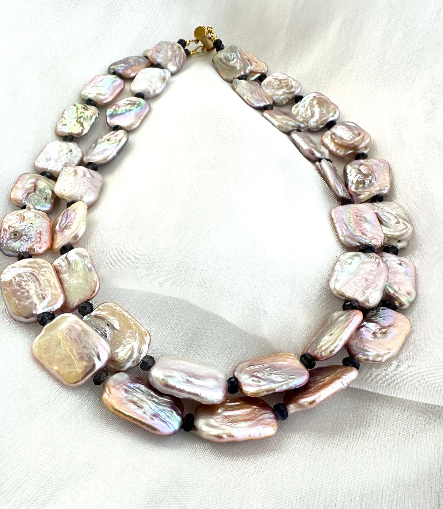 Full view of Statement Pearl Necklace with rectangular pink pearls and iolite gemstones displayed on white background.