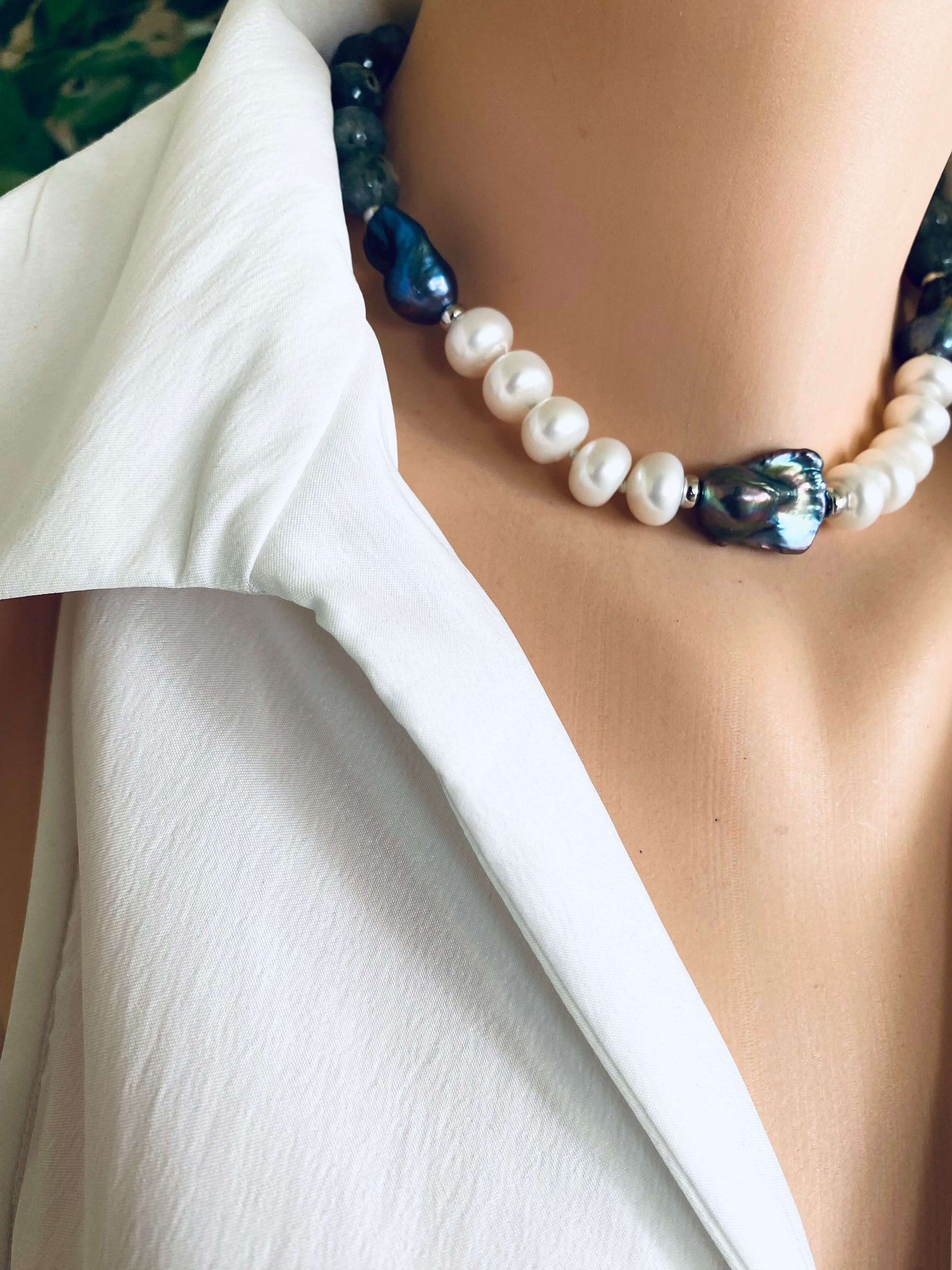 Labradorite pearl necklace with Baroque and coin pearls showcased on a mannequin wearing a white blouse.
