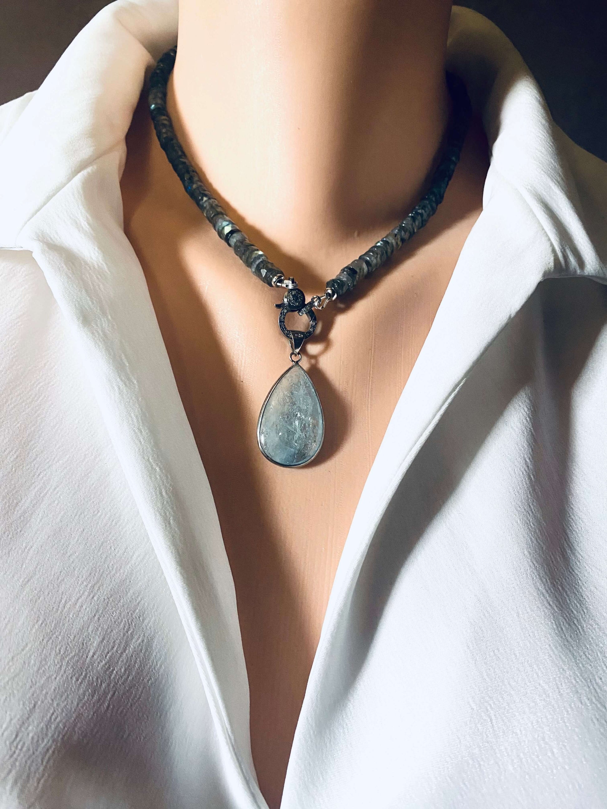 Labradorite beaded necklace with oxidized silver pavé clasp showcasing elegant design and shimmering facets.