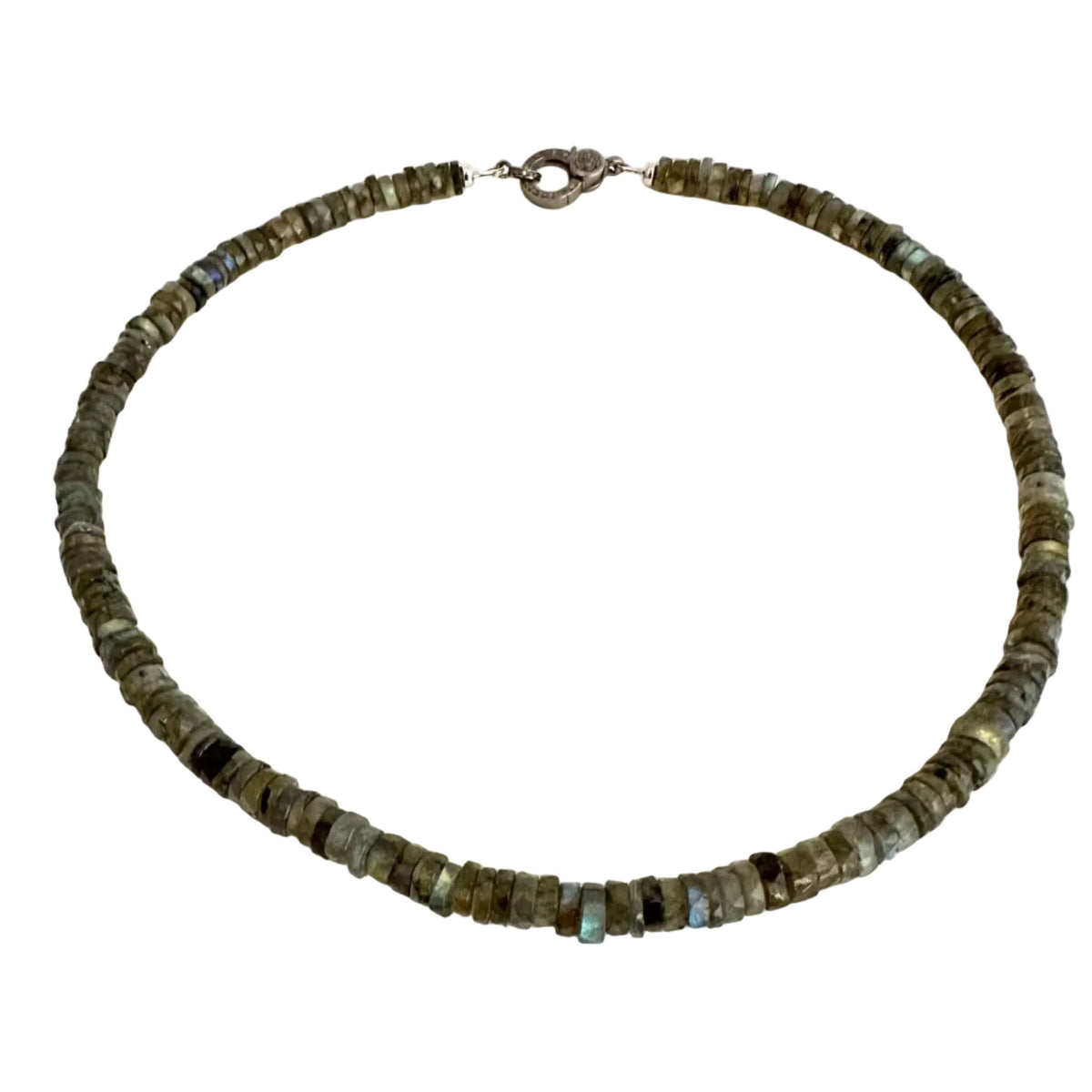 A beaded necklace made of small, irregular dark gray and olive-green stone beads with a silver-toned clasp, displayed on a plain off-white background.
