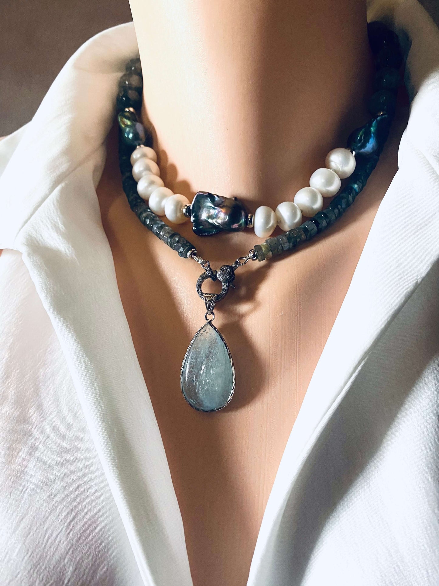 Labradorite beaded necklace with oxidized silver pavé clasp, showcasing light and elegance with unique stones.