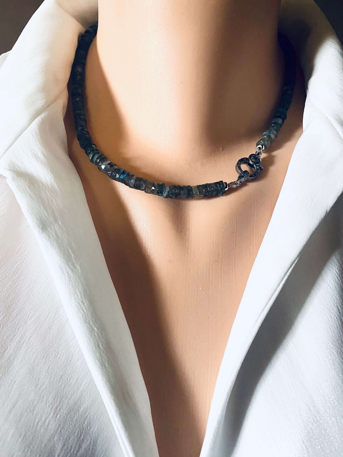 Labradorite beaded necklace with oxidized silver pavé clasp displayed on a mannequin neck, showcasing its elegant design.