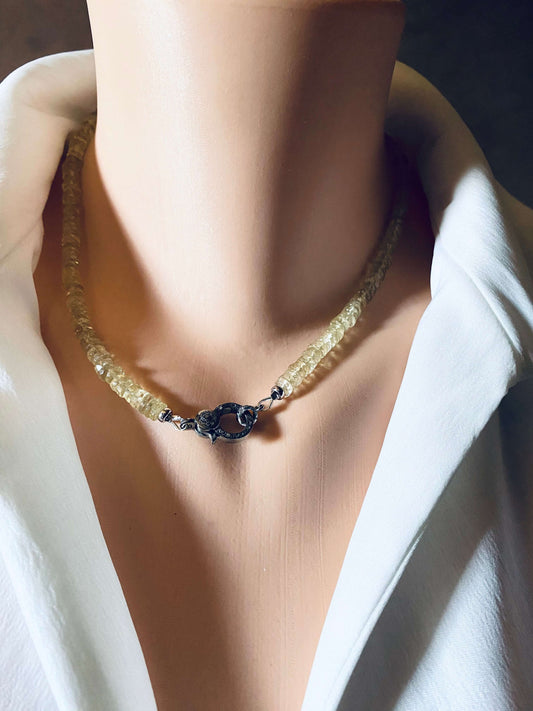 Lemon quartz beaded necklace with oxidized silver pavé clasp displayed on a mannequin against a white shirt.