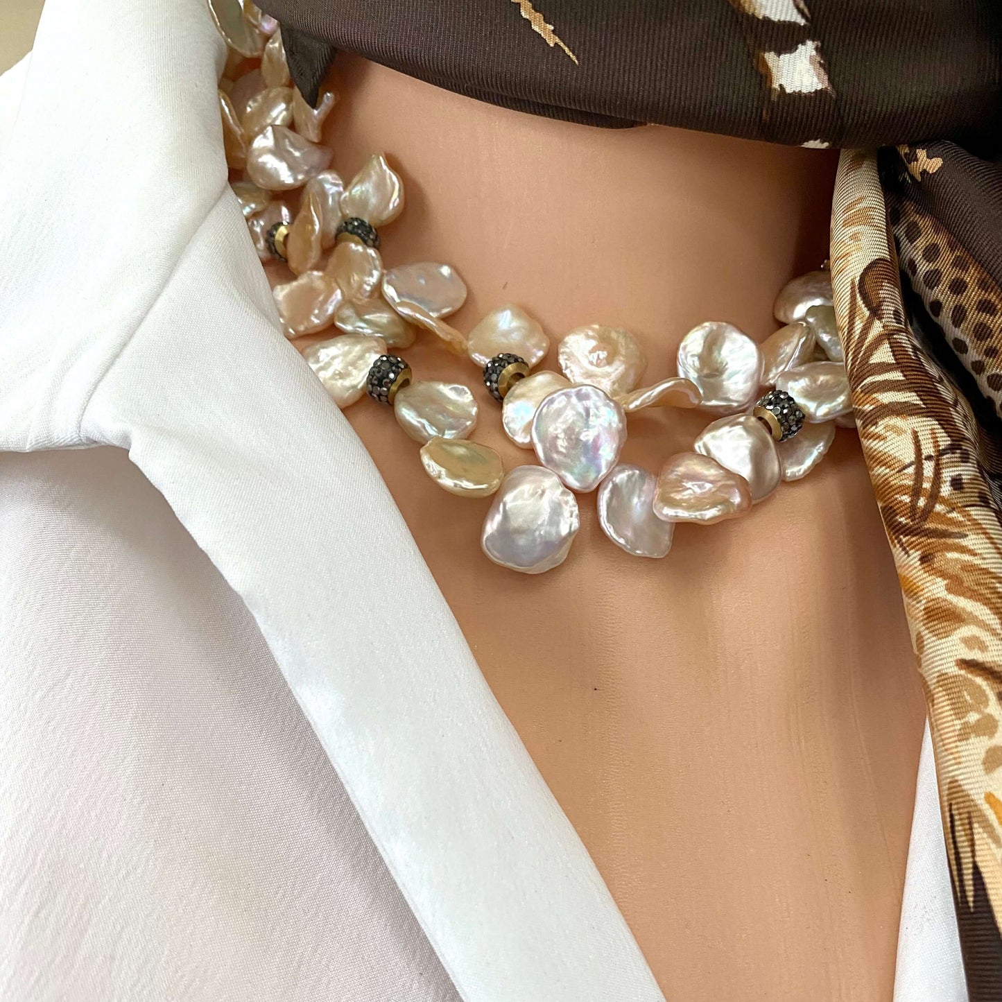 Pink lavender petal pearls choker necklace featuring freshwater pearls in soft hues, elegantly worn on a mannequin.