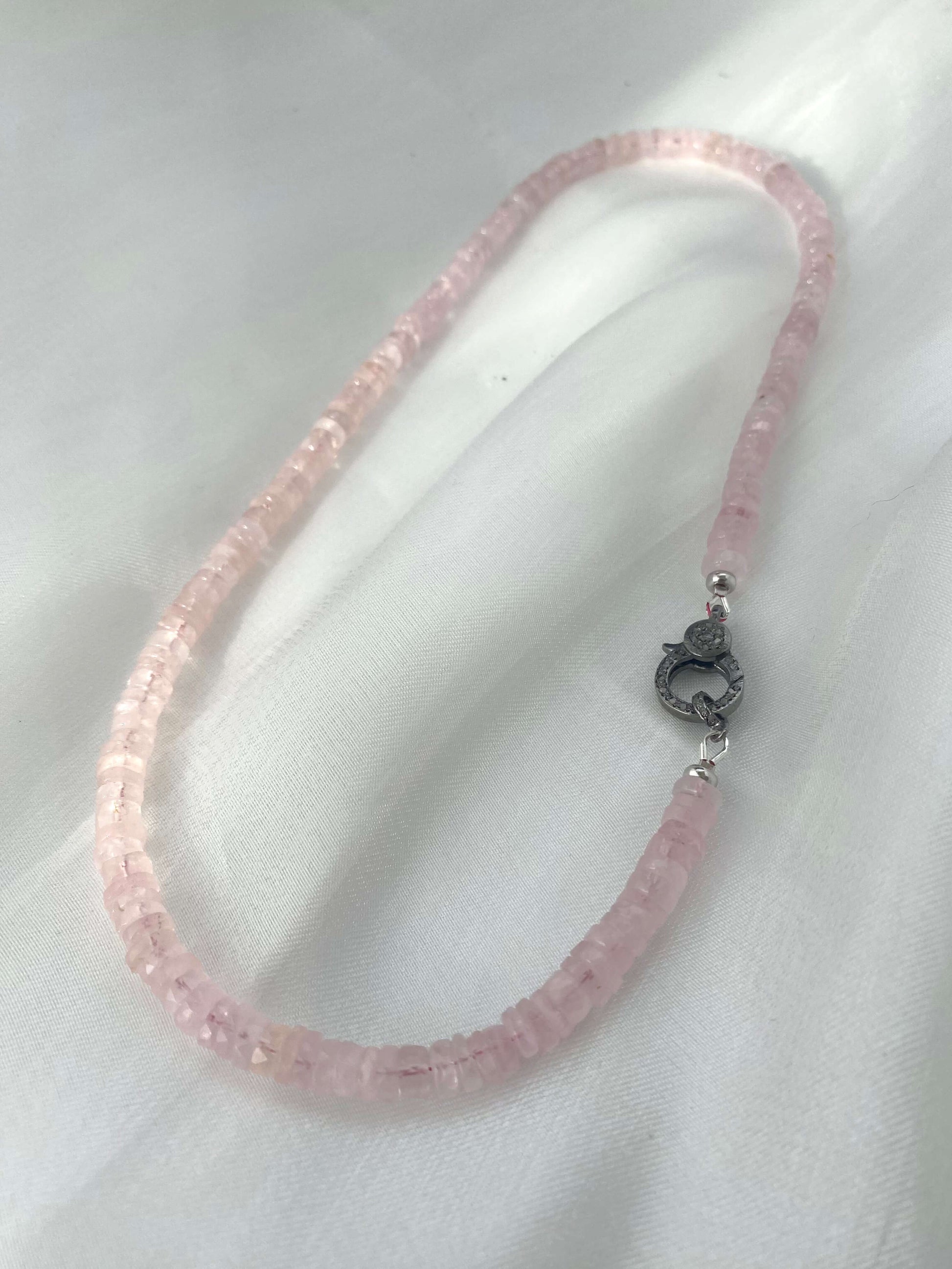 Rose quartz beaded necklace with oxidized silver pavé clasp, showcasing soft, feminine elegance and natural beauty.