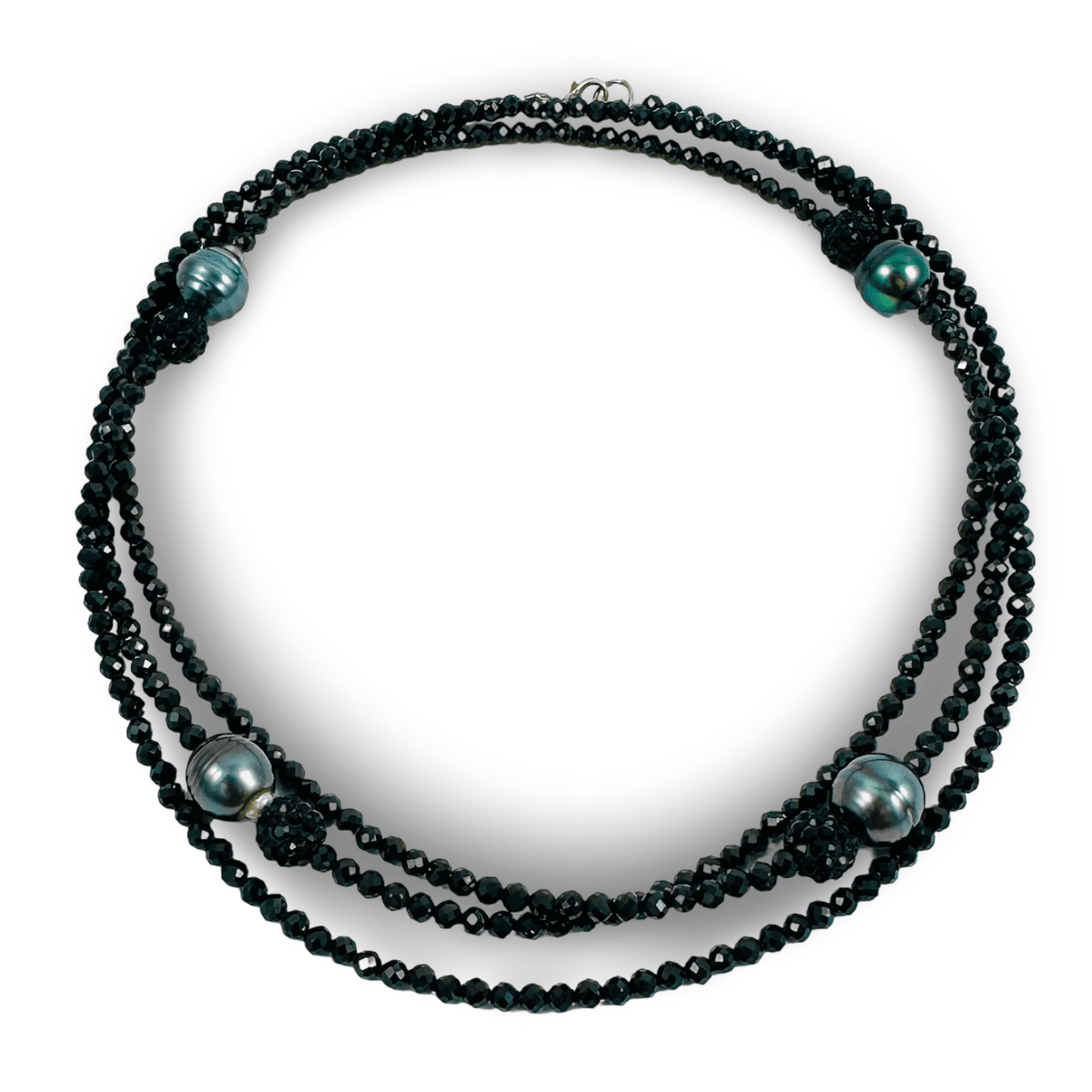 A multi-strand beaded necklace featuring dark faceted beads and five large iridescent greenish-gray pearls, displayed on a clean white background.