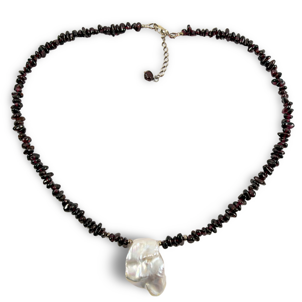 A beaded necklace featuring dark brown to red irregular stone chips with a large, lustrous white baroque pearl pendant at the center, displayed on a clean white background.