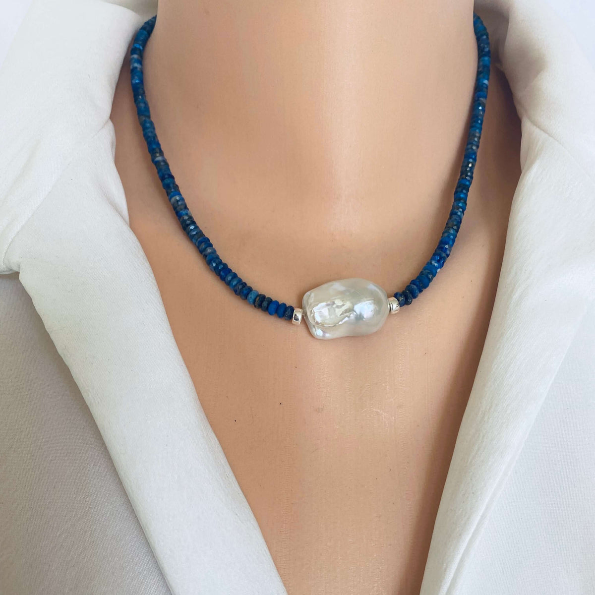 Lapis Lazuli Baroque Pearl Necklace showcasing deep blue gemstones and a classic pearl centerpiece.