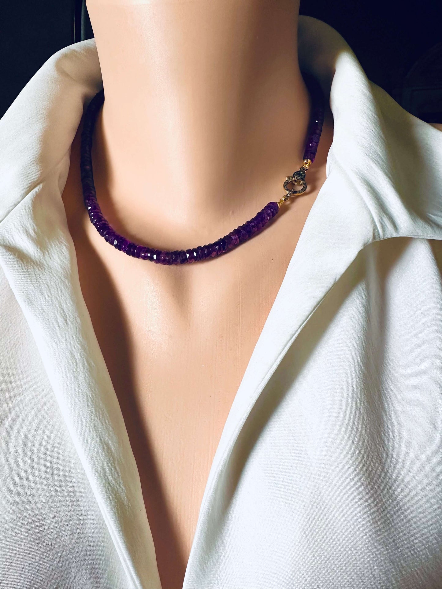 Purple amethyst gemstone necklace displayed on a mannequin, featuring a diamond pavé gold vermeil clasp.