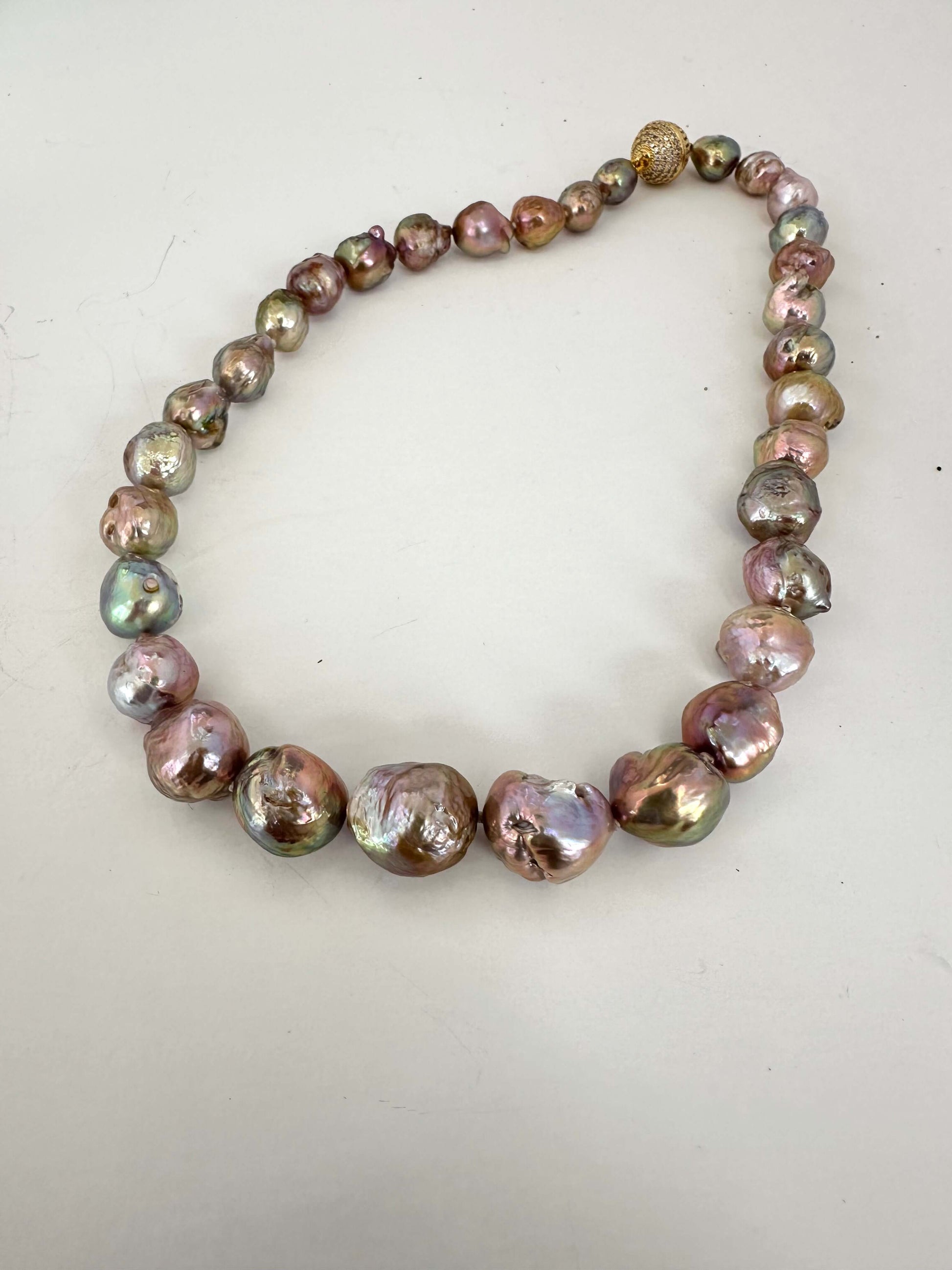 Multicolored pearl necklace on a white background