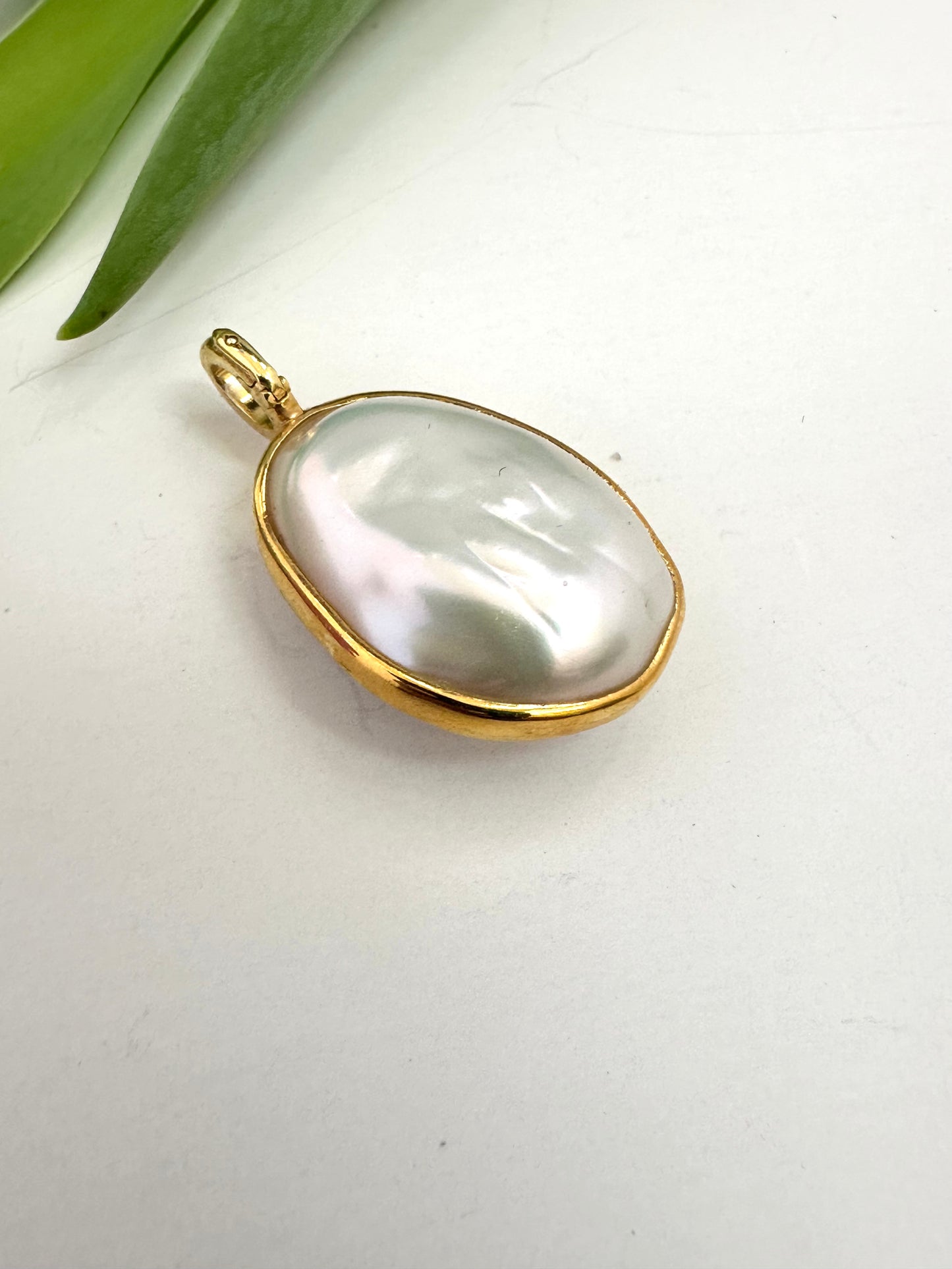 Double-sided baroque pearl pendant set in gold vermeil with opening bail