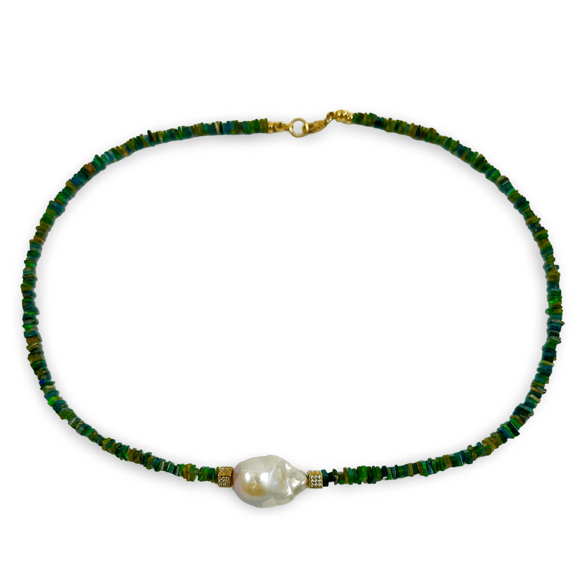 A beaded necklace featuring small green and blue faceted beads with a single large, irregular white baroque pearl at the center, accented by small gold spacer beads and a gold clasp, shown on a plain white background.