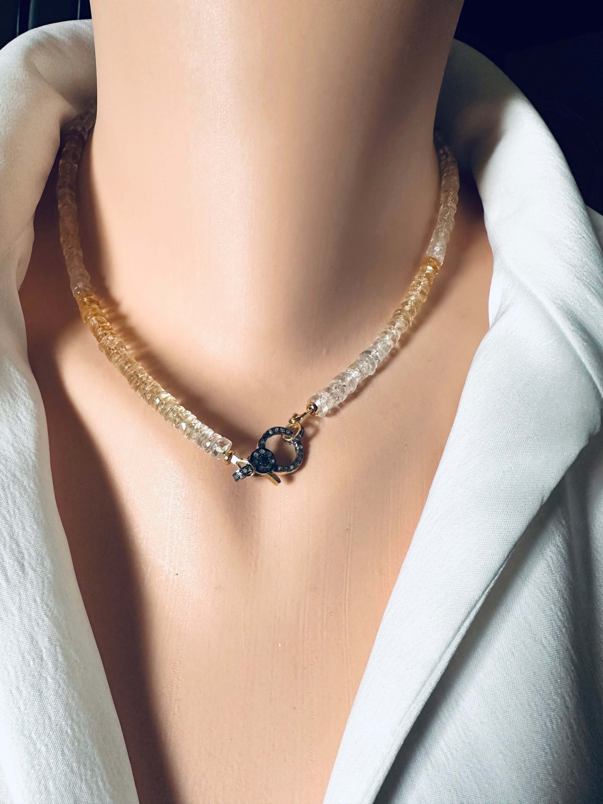 Shaded citrine gemstone necklace with diamond pavé gold vermeil clasp displayed on mannequin.