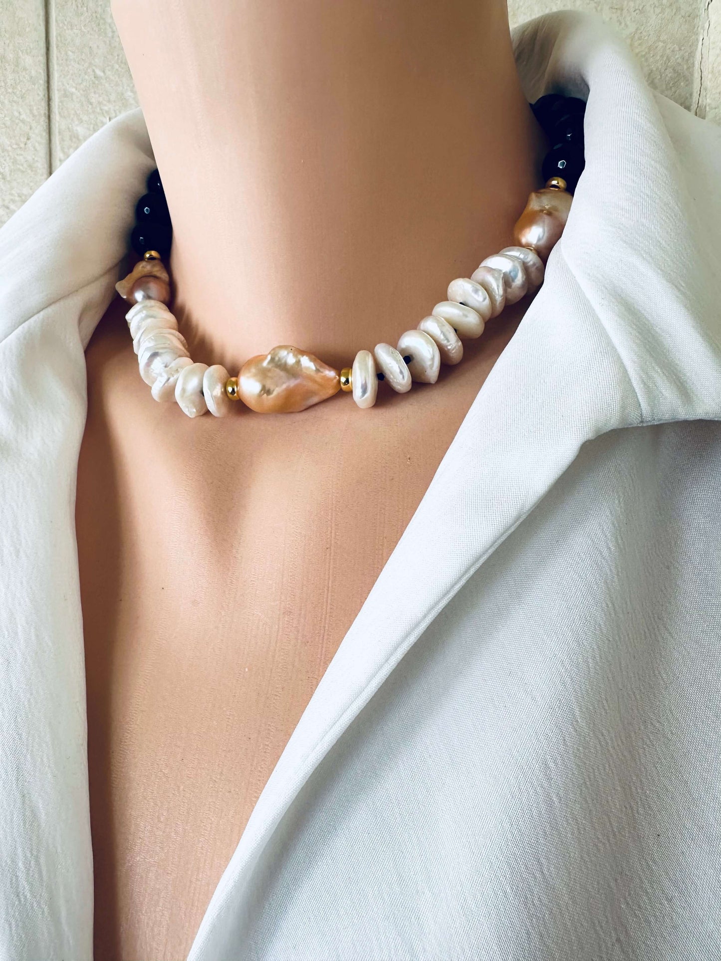 Side view of baroque pearl necklace with black tourmaline and coin pearls, gold vermeil details