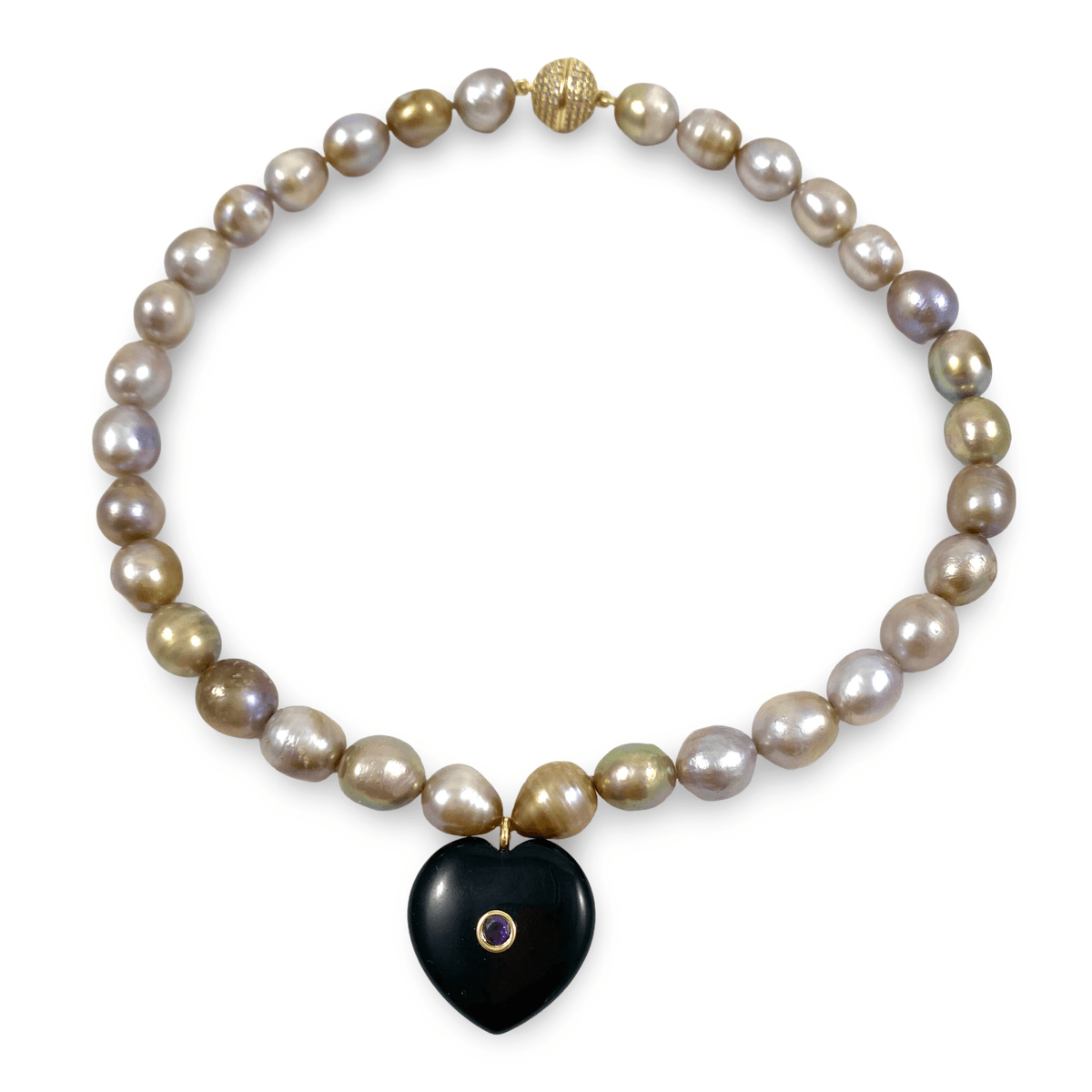 A beaded necklace featuring irregular baroque pearls in iridescent gray, gold, and purple hues, accented with a black heart-shaped pendant and gold-toned metal details, shown on a plain white background.