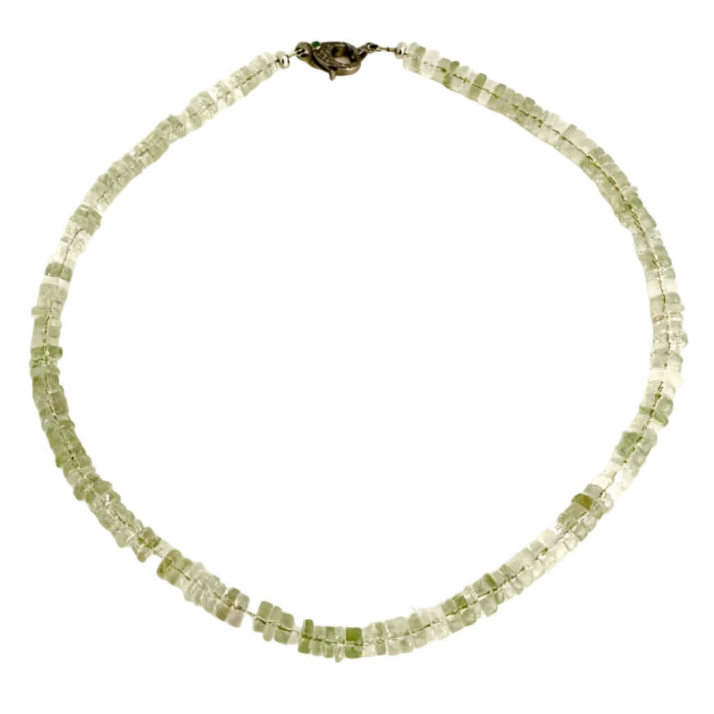 A beaded necklace made of small, faceted light green gemstone beads, arranged in two rows and secured with a dark metal clasp, shown on a plain white background.