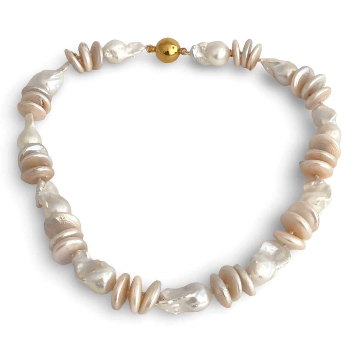 large pink coin pearls with dramatic white baroque pearls, creating a beautiful contrast of soft color, organic shape, and generous scale.