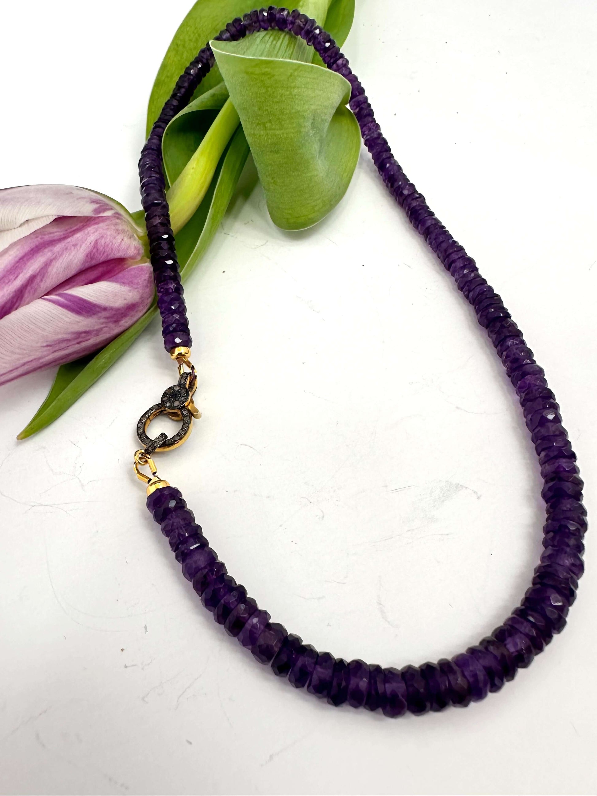 Purple amethyst gemstone necklace with diamond pavé gold vermeil clasp and finely faceted stones.