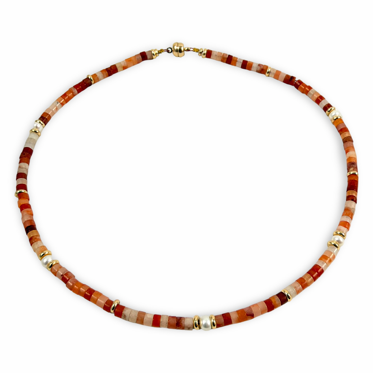 A beaded necklace made of cylindrical stone beads in shades of terracotta, rust, cream, and brown, accented with small gold spacer beads, shown on a plain white background.