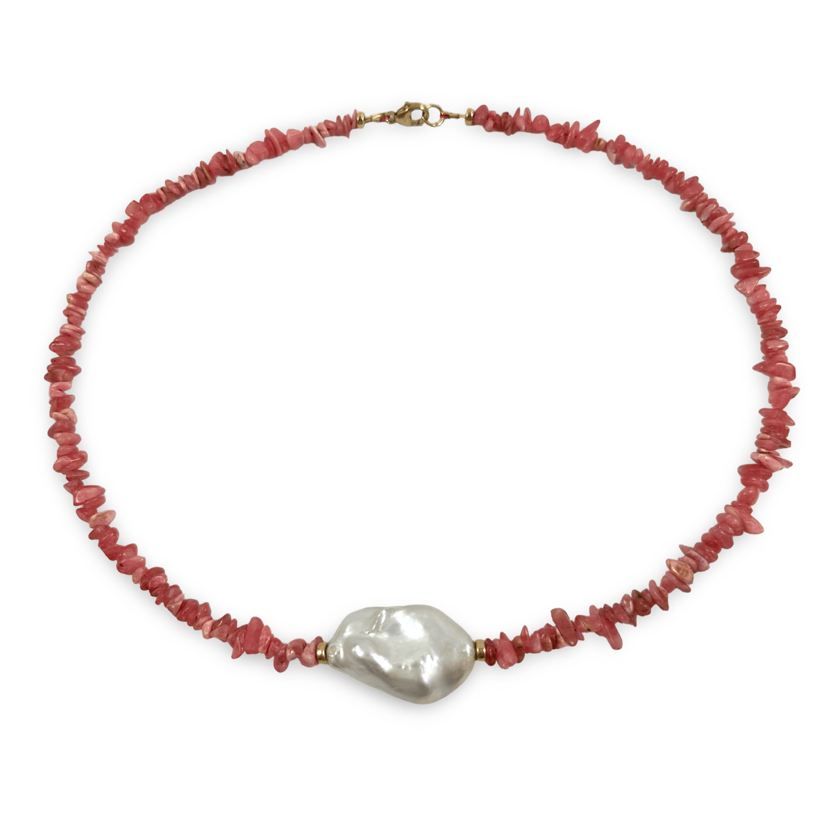 A beaded necklace featuring small, irregular reddish-pink stone chips with a large, lustrous white baroque pearl at the center, finished with a gold-tone clasp.