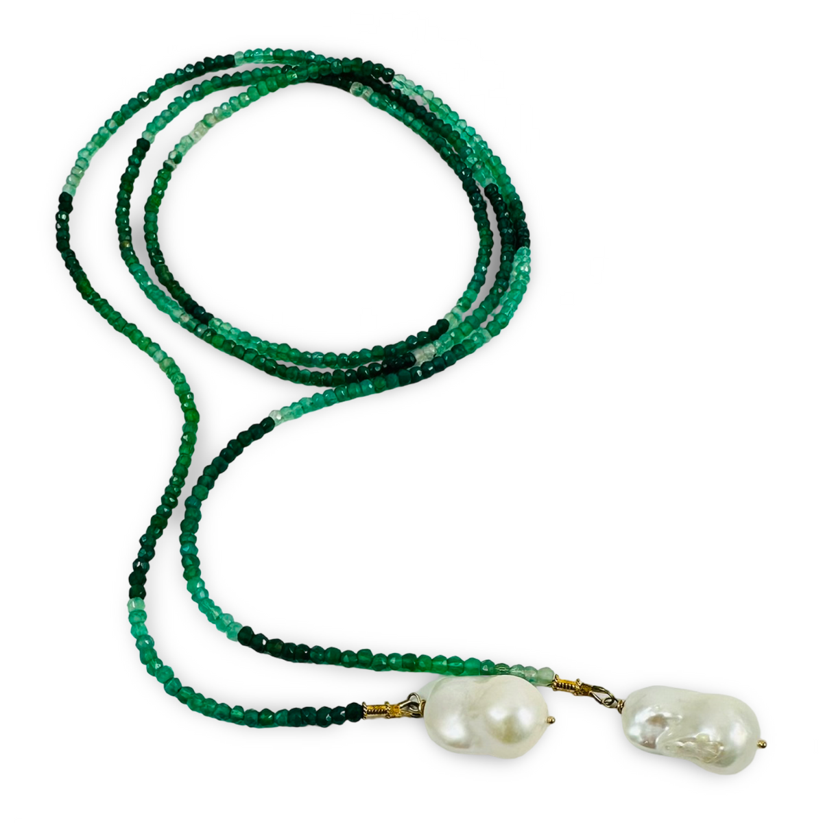 A beaded necklace featuring long strand of faceted green beads transitioning in color from light mint to deep emerald, with two large, irregular white baroque pearls at the ends connected by small gold-toned metal caps, shown on a plain white background.