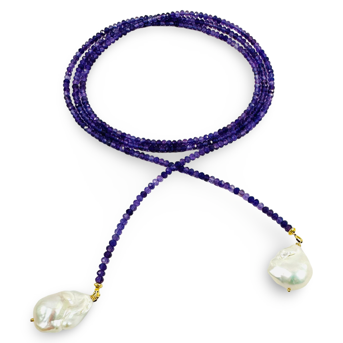A single-strand beaded necklace featuring deep purple amethyst beads and two large, irregular white baroque pearls suspended from gold-toned settings, displayed on a clean white background.