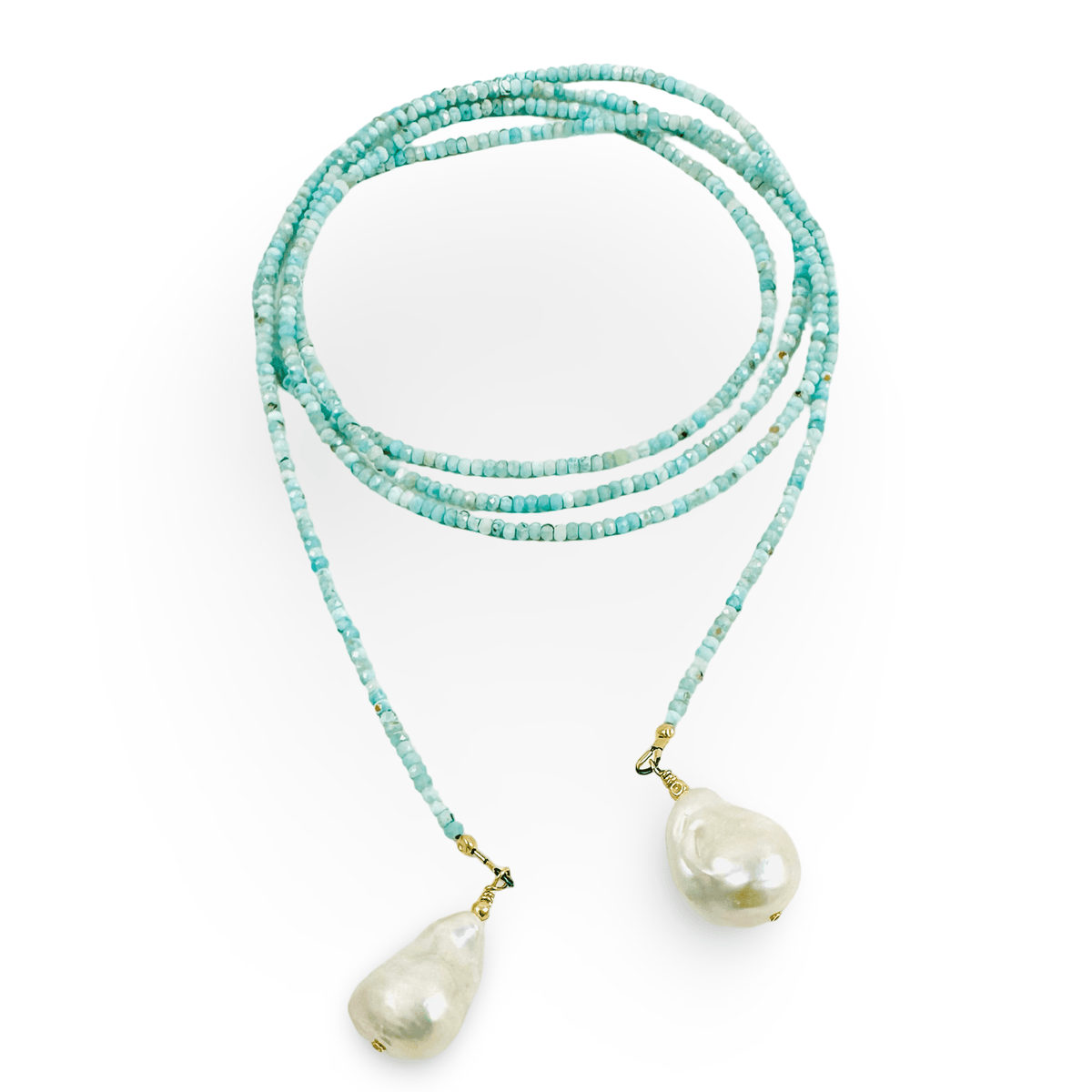 A long-strand beaded necklace in light  blue and white beads with two large, irregular white baroque pearls hanging from gold-toned clasps, displayed on a clean white background.