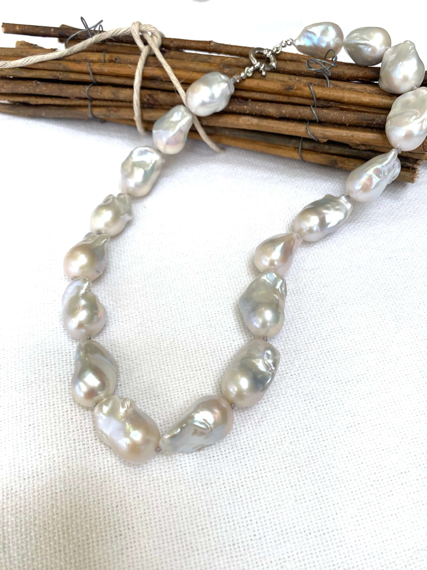 Baroque Pearl Chunky Necklace showcasing unique white freshwater pearls handcrafted on grey silk.