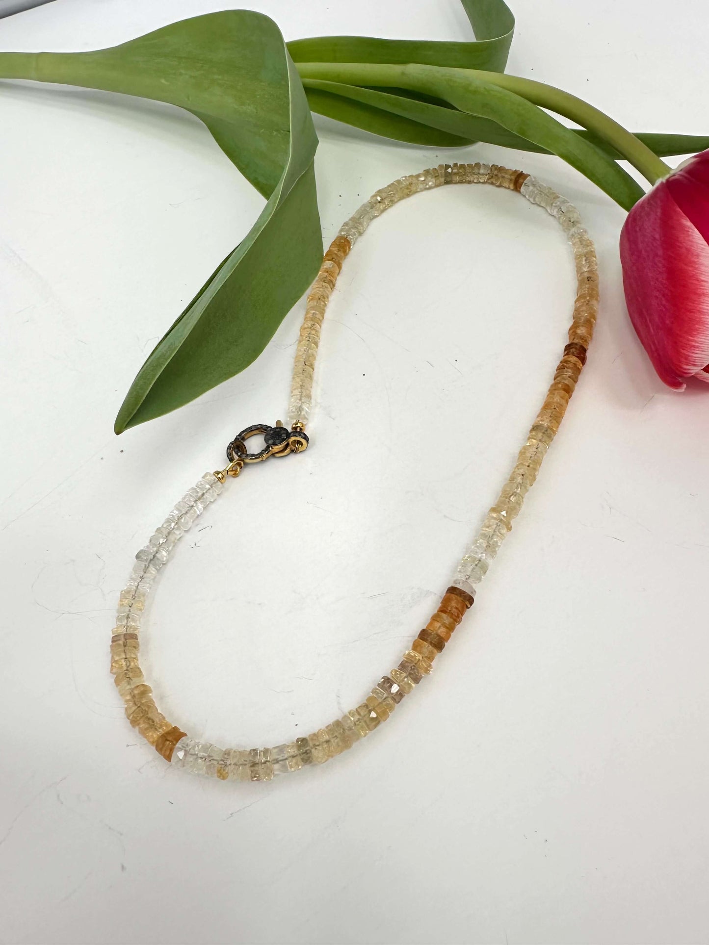 Shaded citrine gemstone necklace with diamond pavé gold vermeil clasp, showcasing a gradient of golden hues.