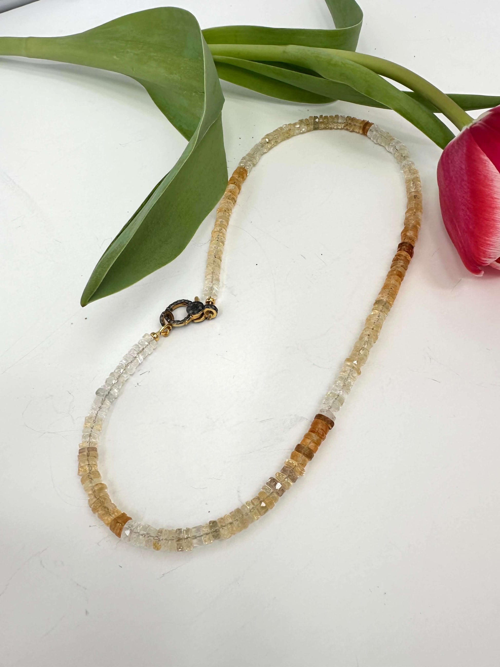 Shaded citrine gemstone necklace with diamond pavé gold vermeil clasp, showcasing a gradient of golden hues.