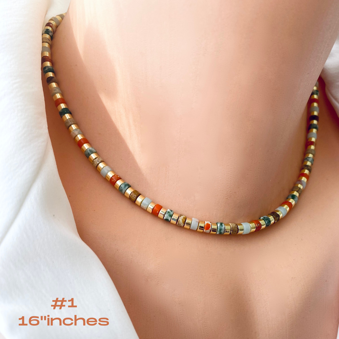 Gemstone choker necklace with multi color beads showcased on a mannequin, 16 inches in length.