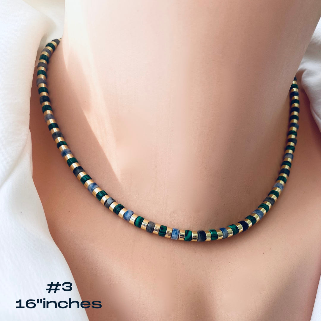 Gemstone choker necklace with multicolor beads displayed on a mannequin, featuring vibrant tube-shaped gemstones.