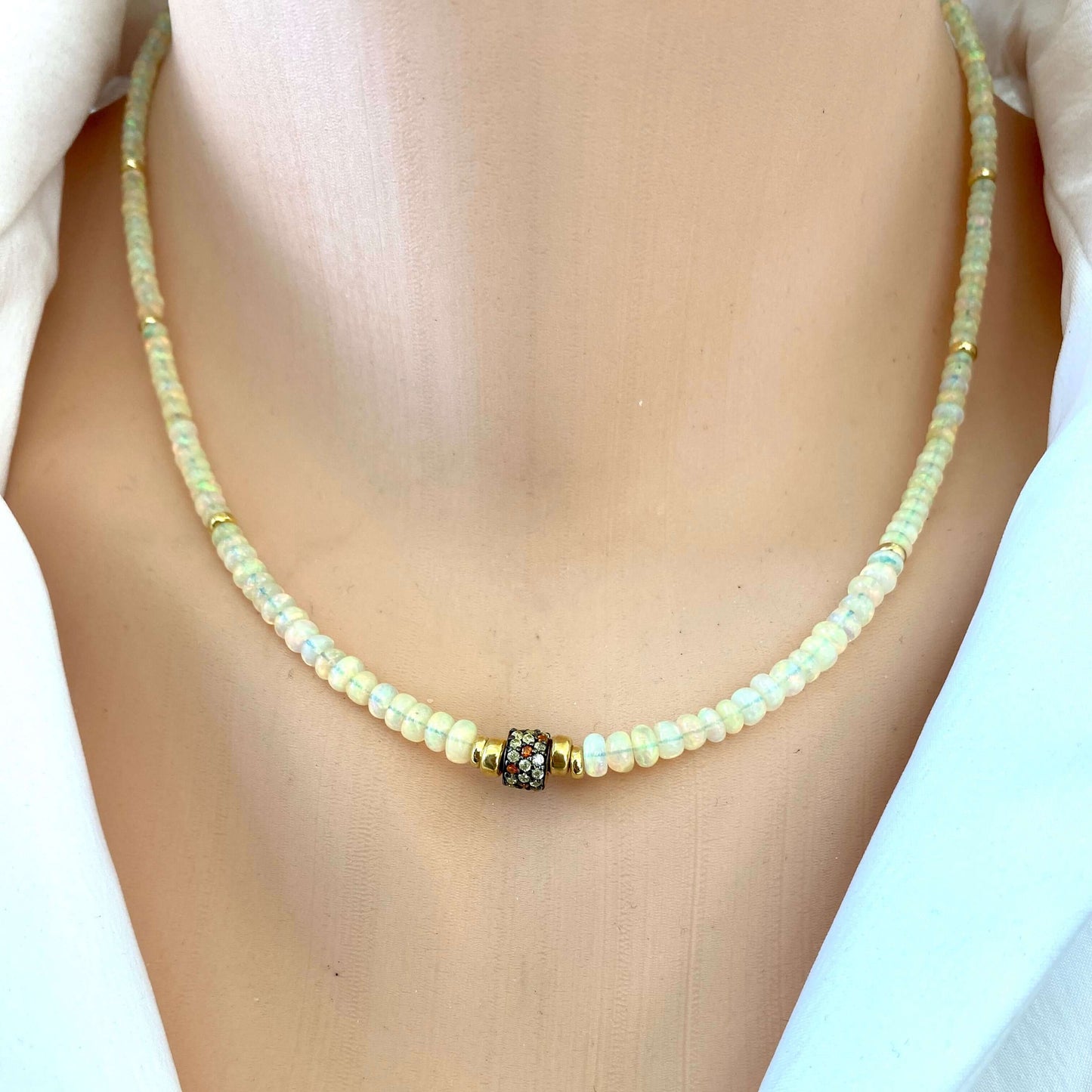Ethiopian opal necklace close-up on model, lightweight everyday opal necklace with gold accents