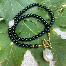 Load image into Gallery viewer, Elegant classic necklace made of black onyx beads and natural pearl. Timeless combination of black and white will suit any outfit. 
