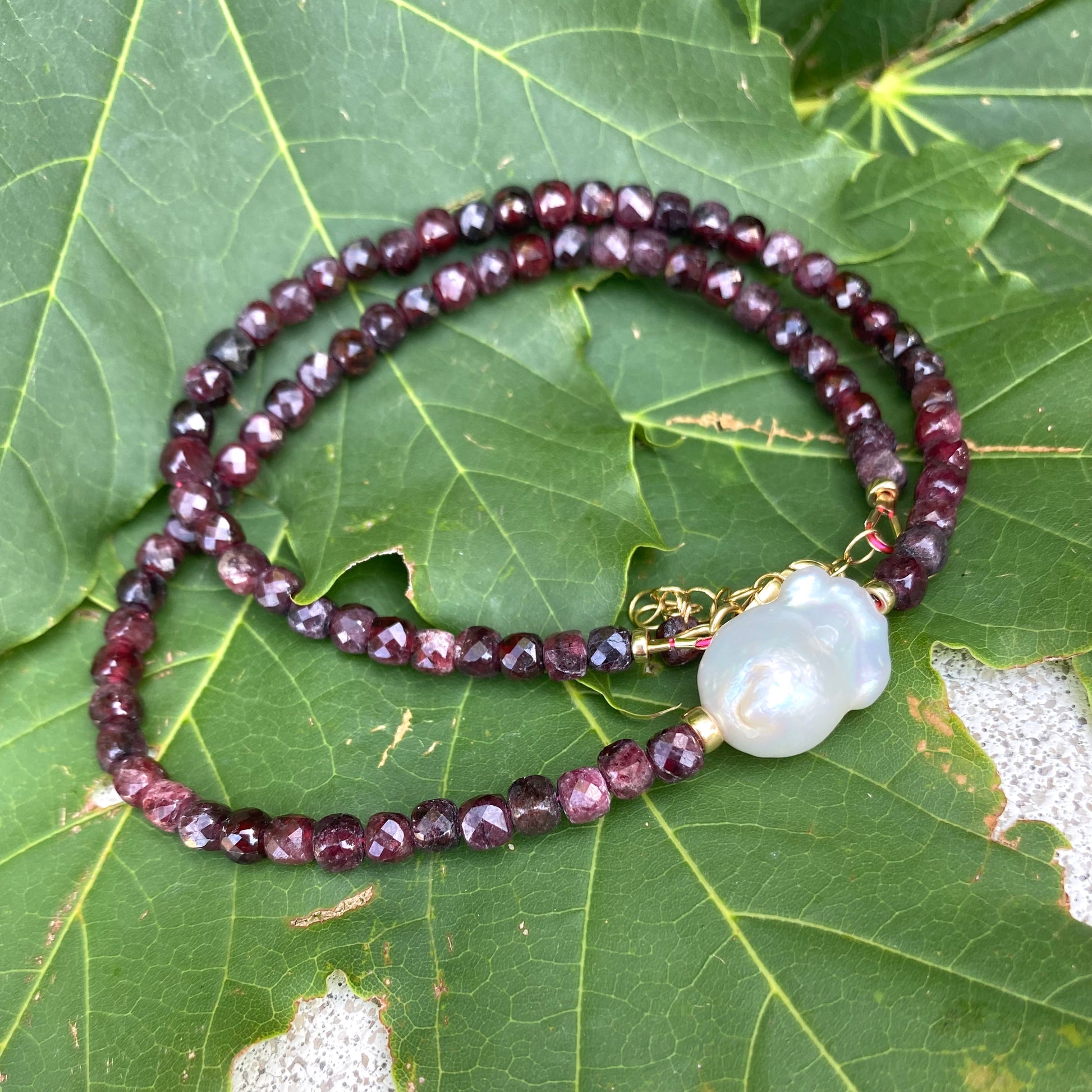 Garnet pearl necklace featuring deep red garnet beads and freshwater baroque pearl