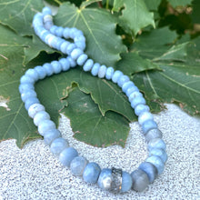 Charger l&#39;image dans la galerie, hand knotted and shaded blue boulder opal faceted rondelle beads necklace , with diamond pavé sterling silver embellishment ring in the center. Finished with silver marine closure. 19.5inches long.
