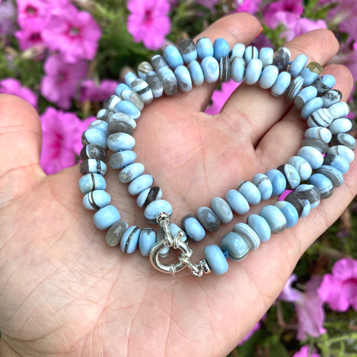 Blue boulder opal candy necklace showing natural color variation in opal rondelle beads