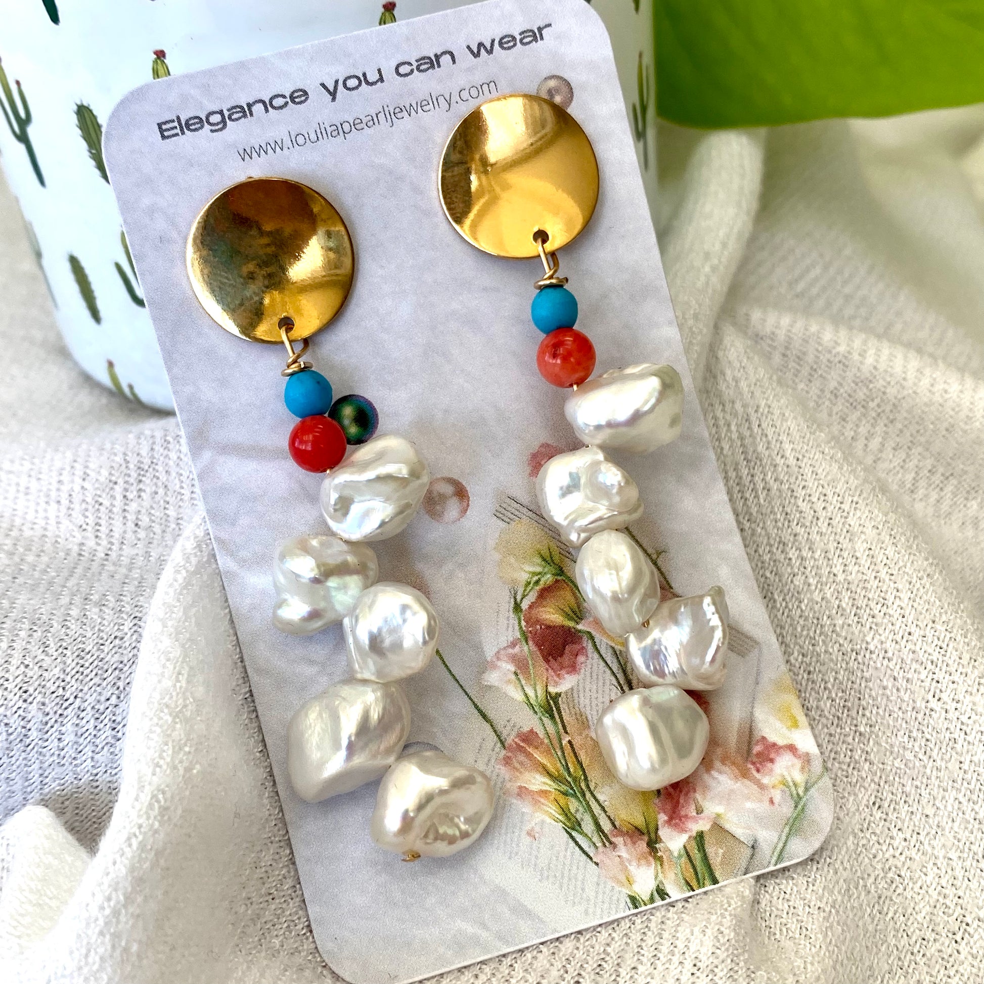 Baroque Keshi Pearl Earrings on branded jewelry packaging, displayed on white fabric with green leaves, handmade in Canada