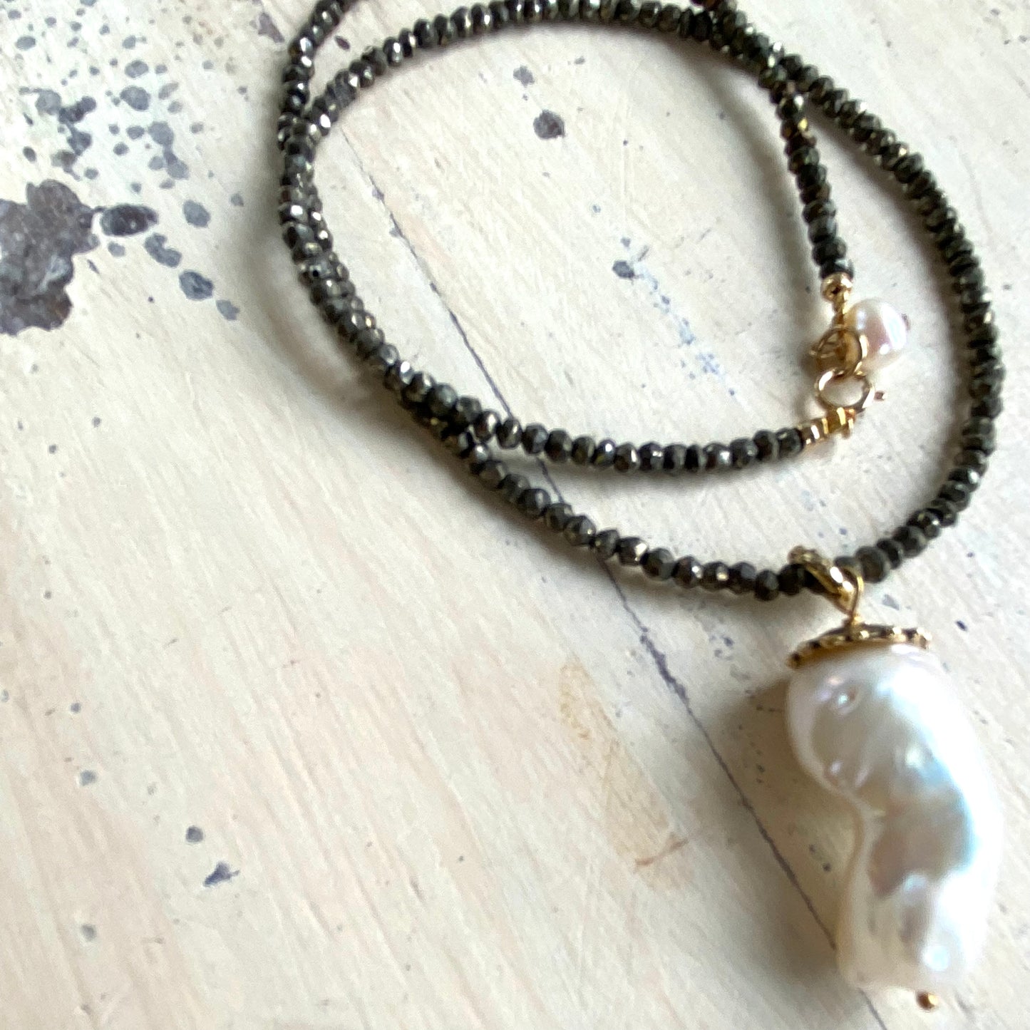 Baroque pearl pendant necklace featuring bronze pyrite beads gold bronze cap and gold filled clasp