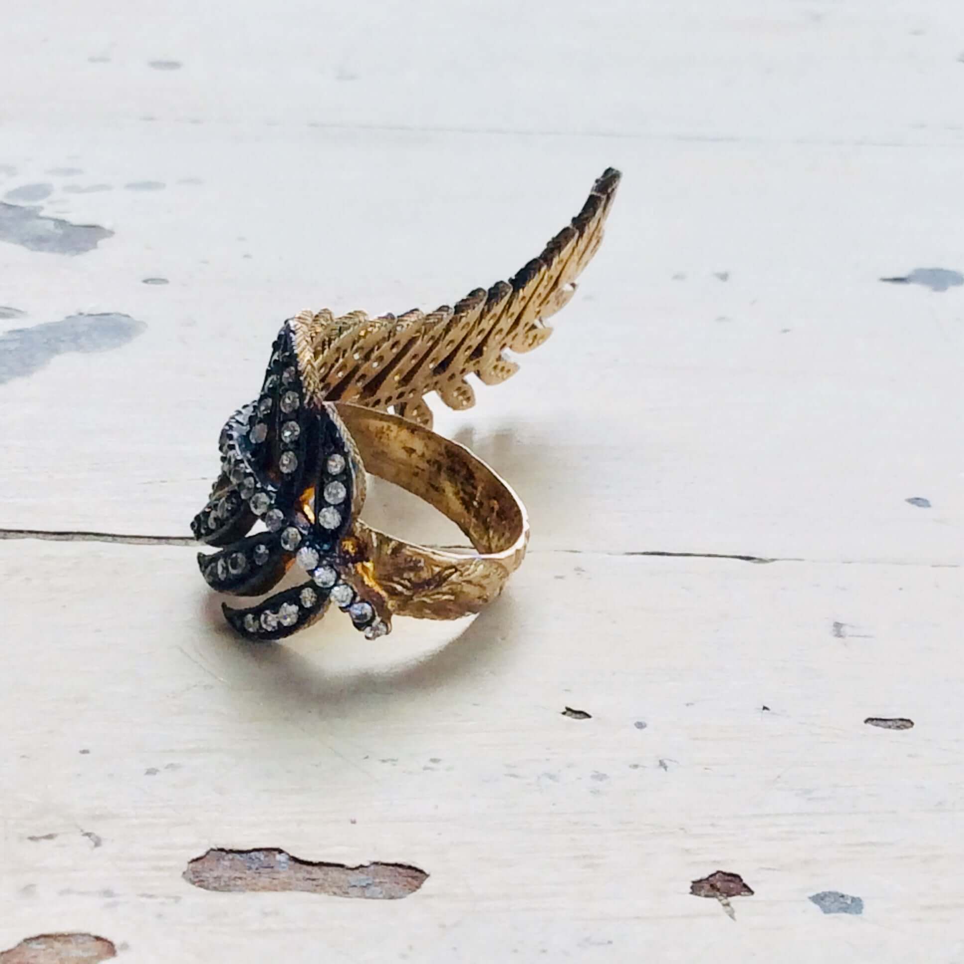 Vermeil Leaf Shape Ring showcasing an antique finish with cubic zirconia accents on an artistic design.