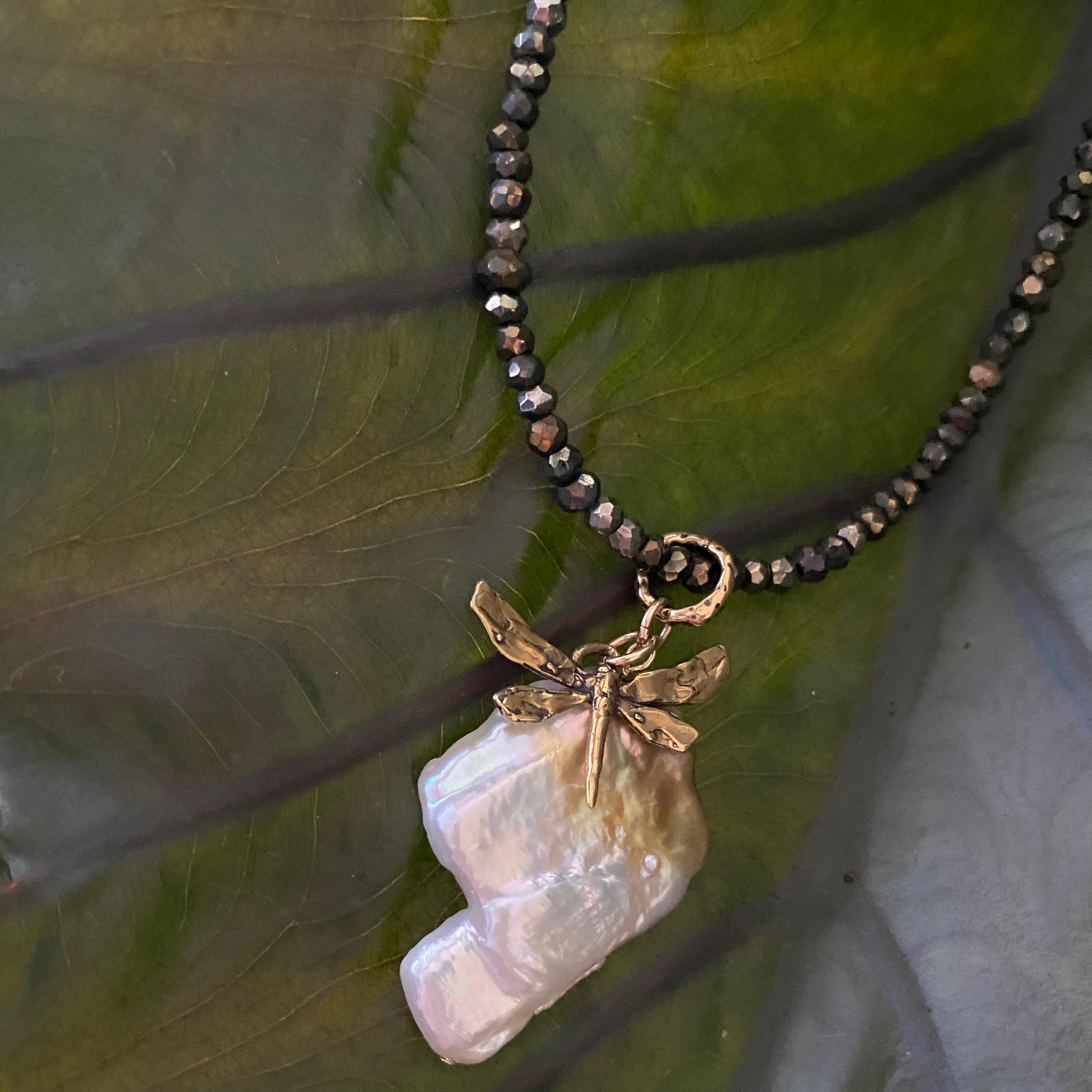 Keshi pearl pendant necklace featuring large freshwater keshi pearl and artisan bronze dragonfly charm
