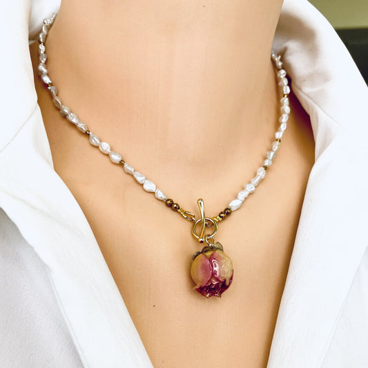 Real pink rosebud pearl necklace worn on model with natural freshwater pearls and gold accents