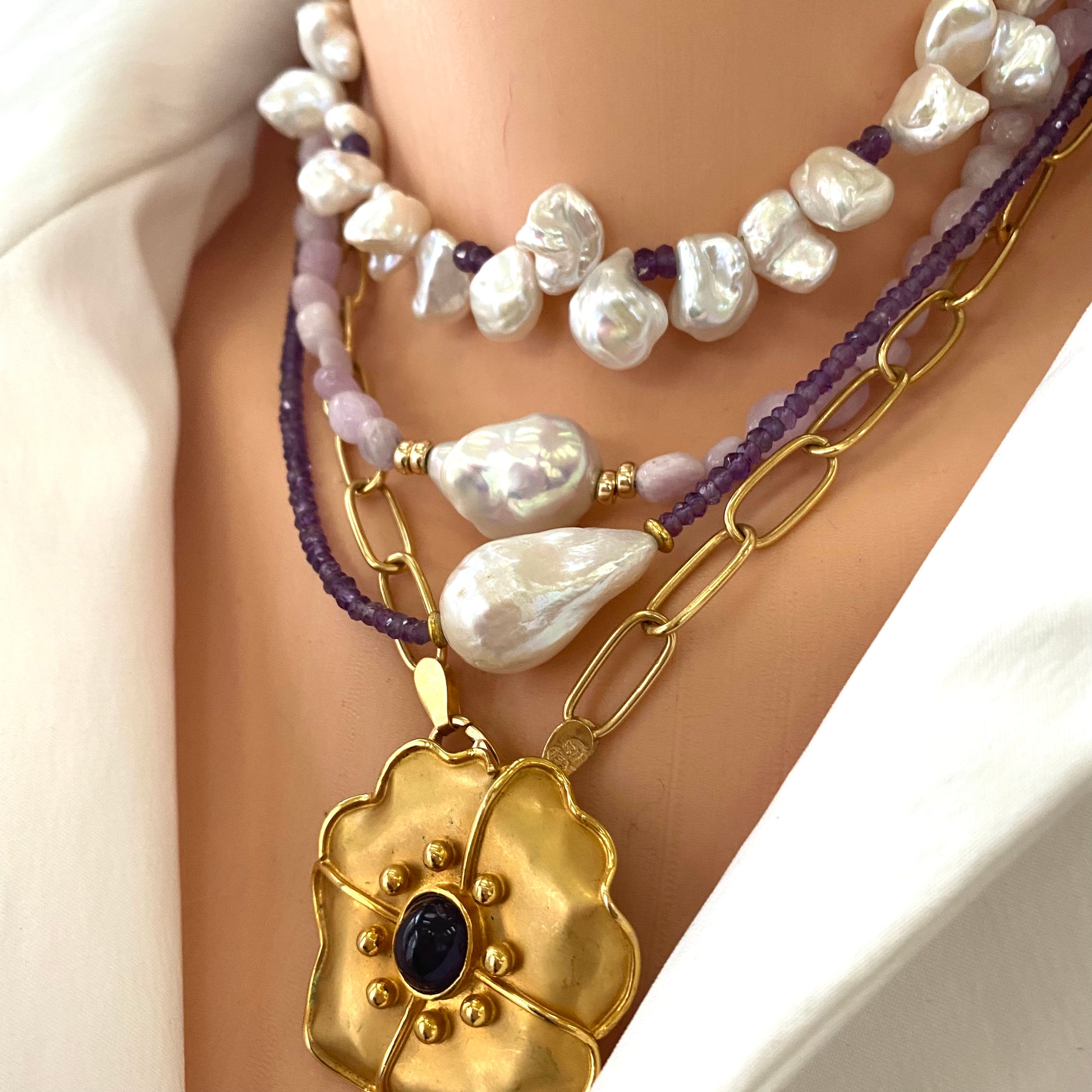 Purple amethyst baroque pearl necklace layered with pearls for a statement look