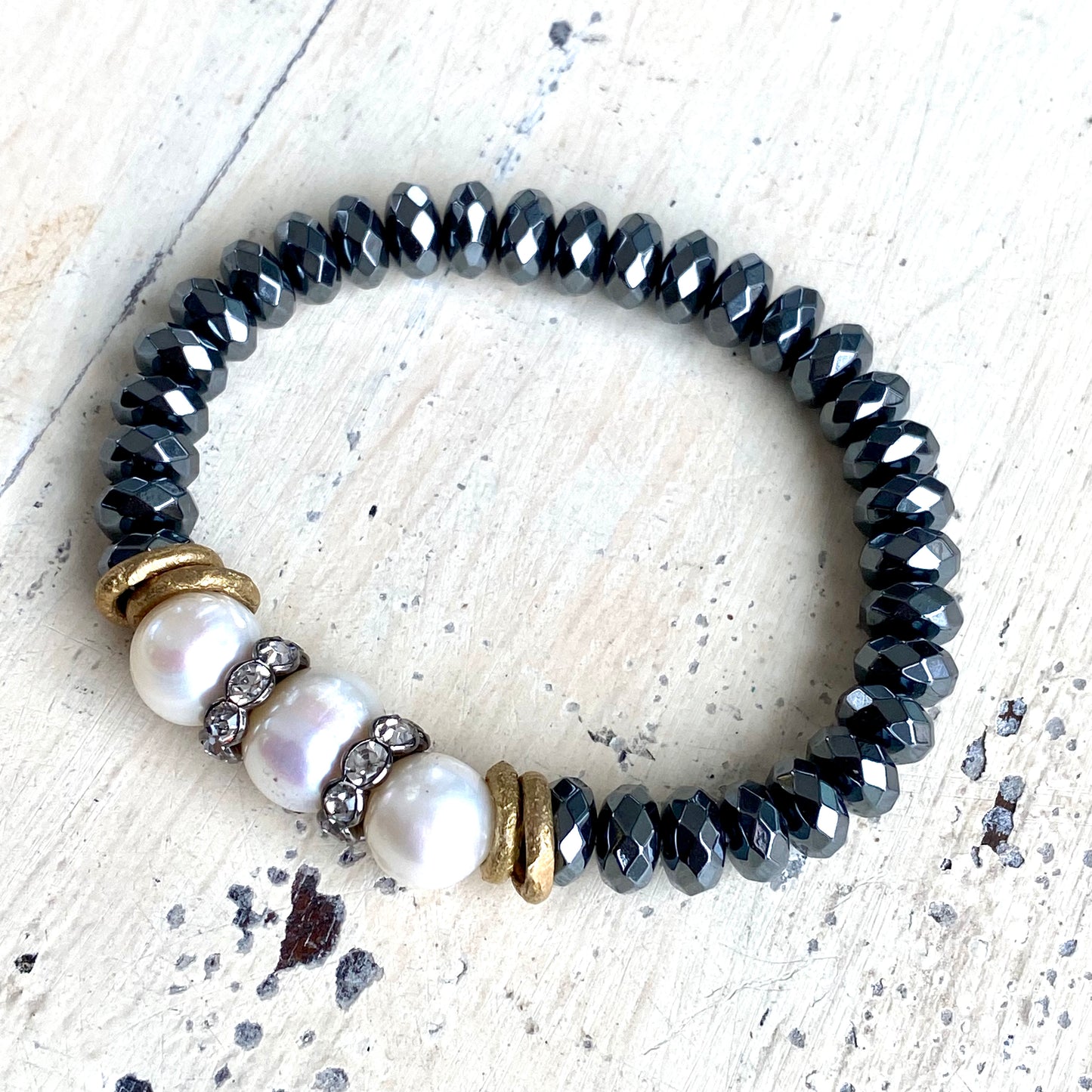 Freshwater pearl hematite stretch bracelet close-up showing rondelle hematite bead texture