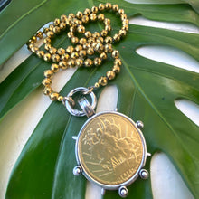 Load image into Gallery viewer, Elevate your style with this stunning Gold Faceted Hematite Beads 8mm and Repro Mexican Peso Coin Pendant Necklace. Featuring a unique Horse Coin Equestrian Pendant, this 28-inch hand-knotted necklace is the perfect piece to add to your collection.
