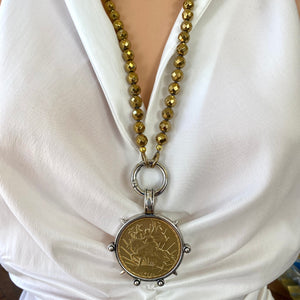 Elevate your style with this stunning Gold Faceted Hematite Beads 8mm and Repro Mexican Peso Coin Pendant Necklace. Featuring a unique Horse Coin Equestrian Pendant, this 28-inch hand-knotted necklace is the perfect piece to add to your collection.