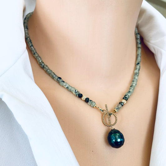 Prehnite tahitian pearl necklace worn at the neckline with green prehnite beads and Tahitian baroque pearl