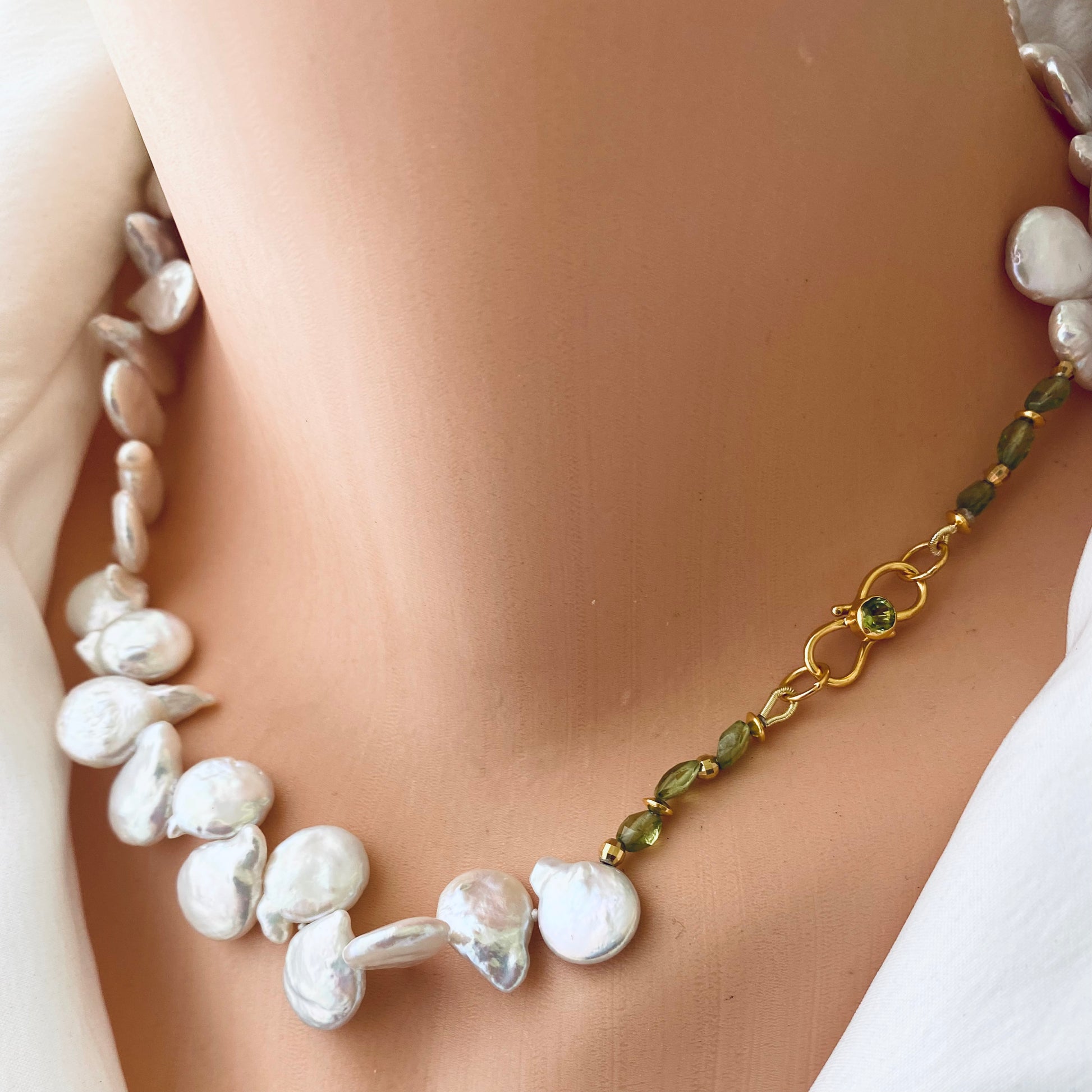 Keshi pearl necklace featuring AAA-quality pearls with a unique shape and green peridot accents.
