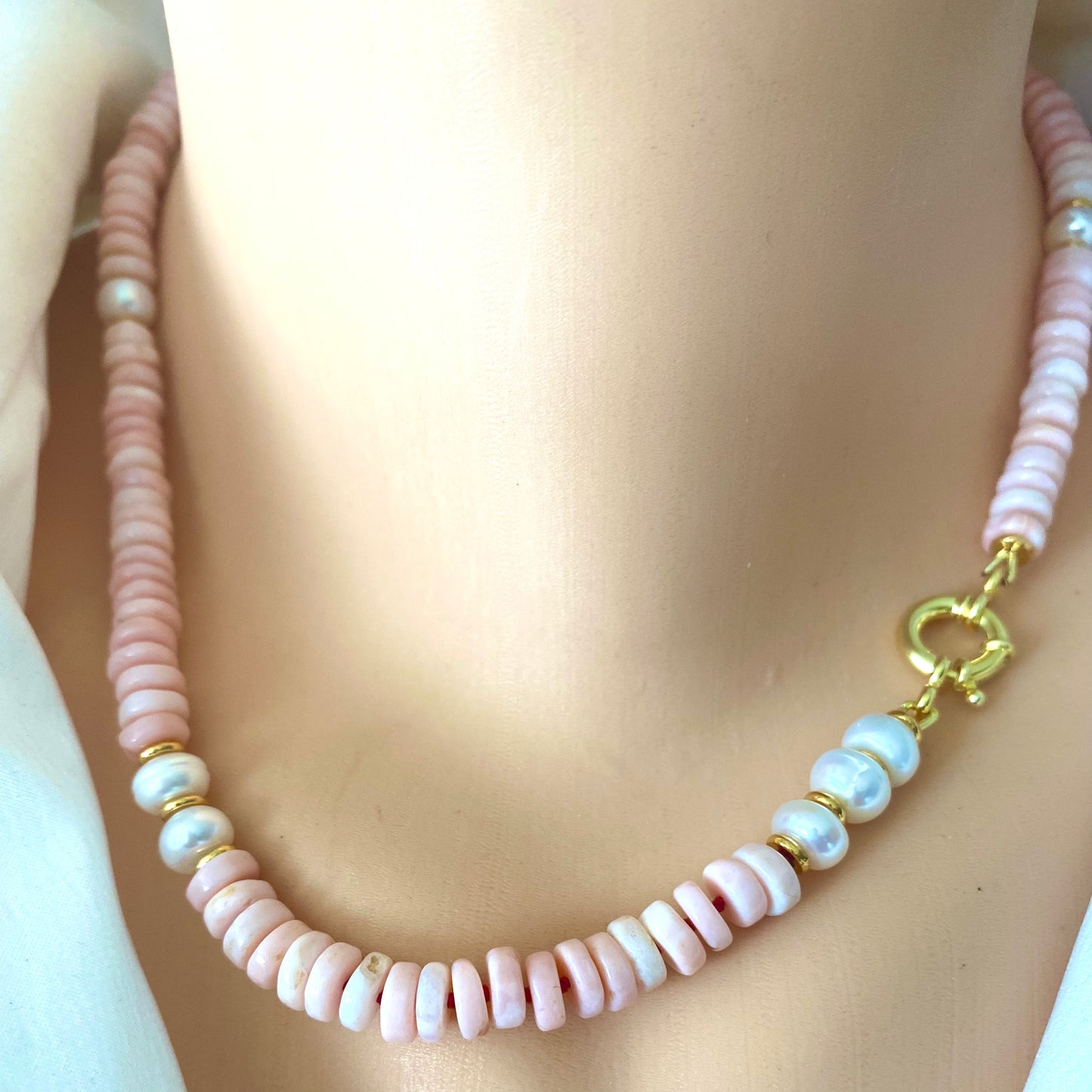 Pink opal pearl necklace worn without pendant showing pink opal and pearl bead detail